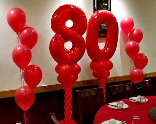 Mardi Gras themed photo backdrop for high school graduation